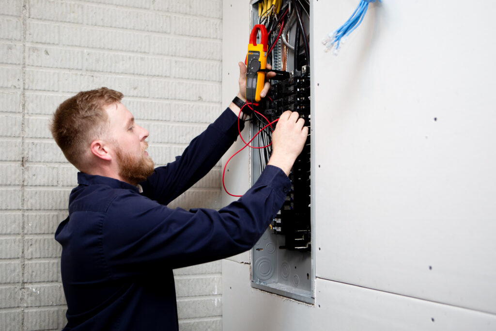 Electrician replacing electrical panel
